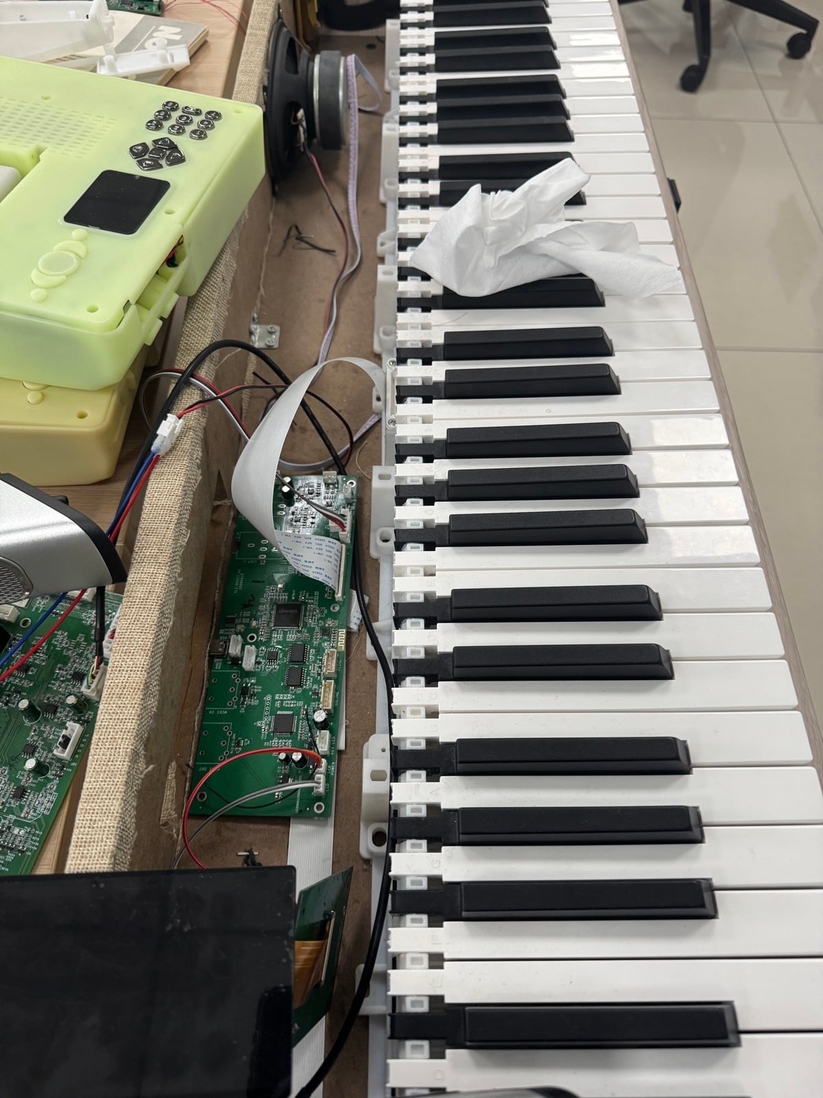 Inside the prototype: main circuit board and sensor connections behind the keys